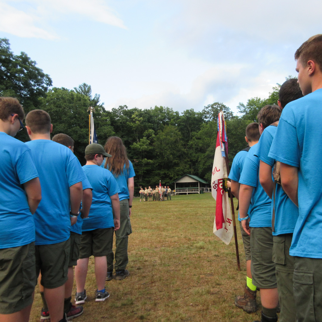 Troop 106 lining up on the parade field at summer camp